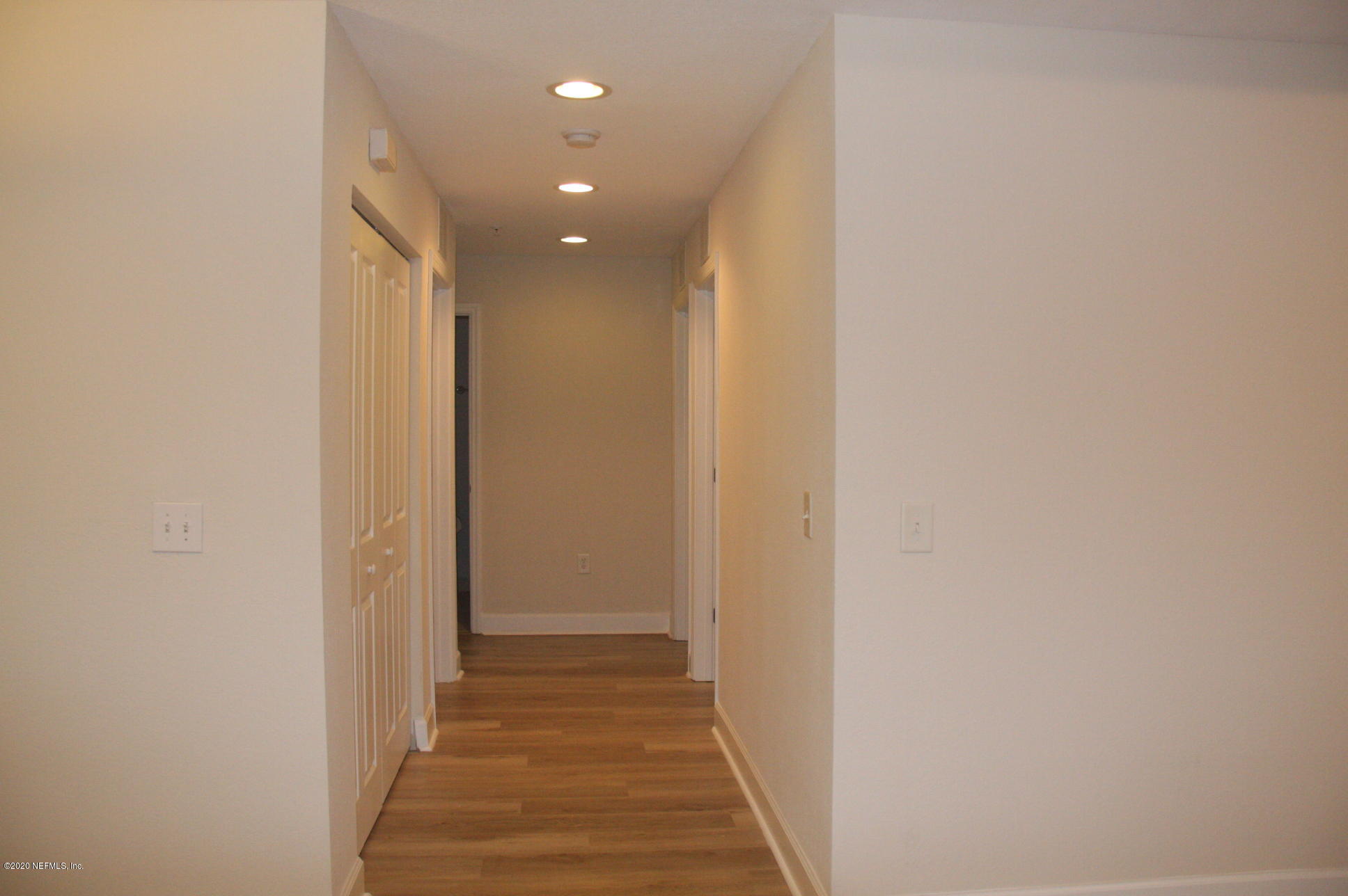 9745 Touchton Road, Unit 2401 Jacksonville, FL 32246 - Photo 24 of 50 a view of a hallway with wooden floor