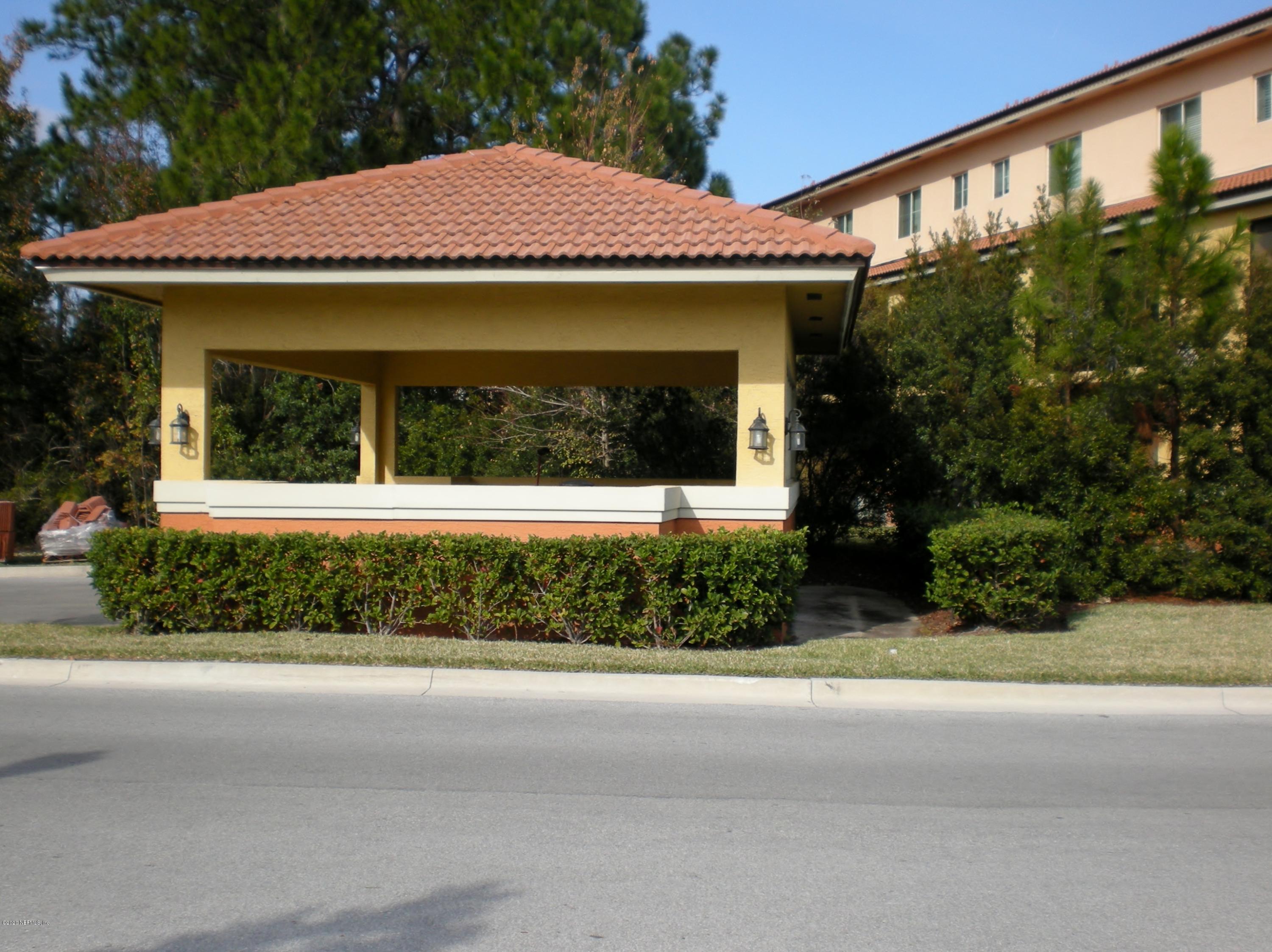 9745 Touchton Road, Unit 2401 Jacksonville, FL 32246 - Photo 49 of 50 a view of a house with a garden