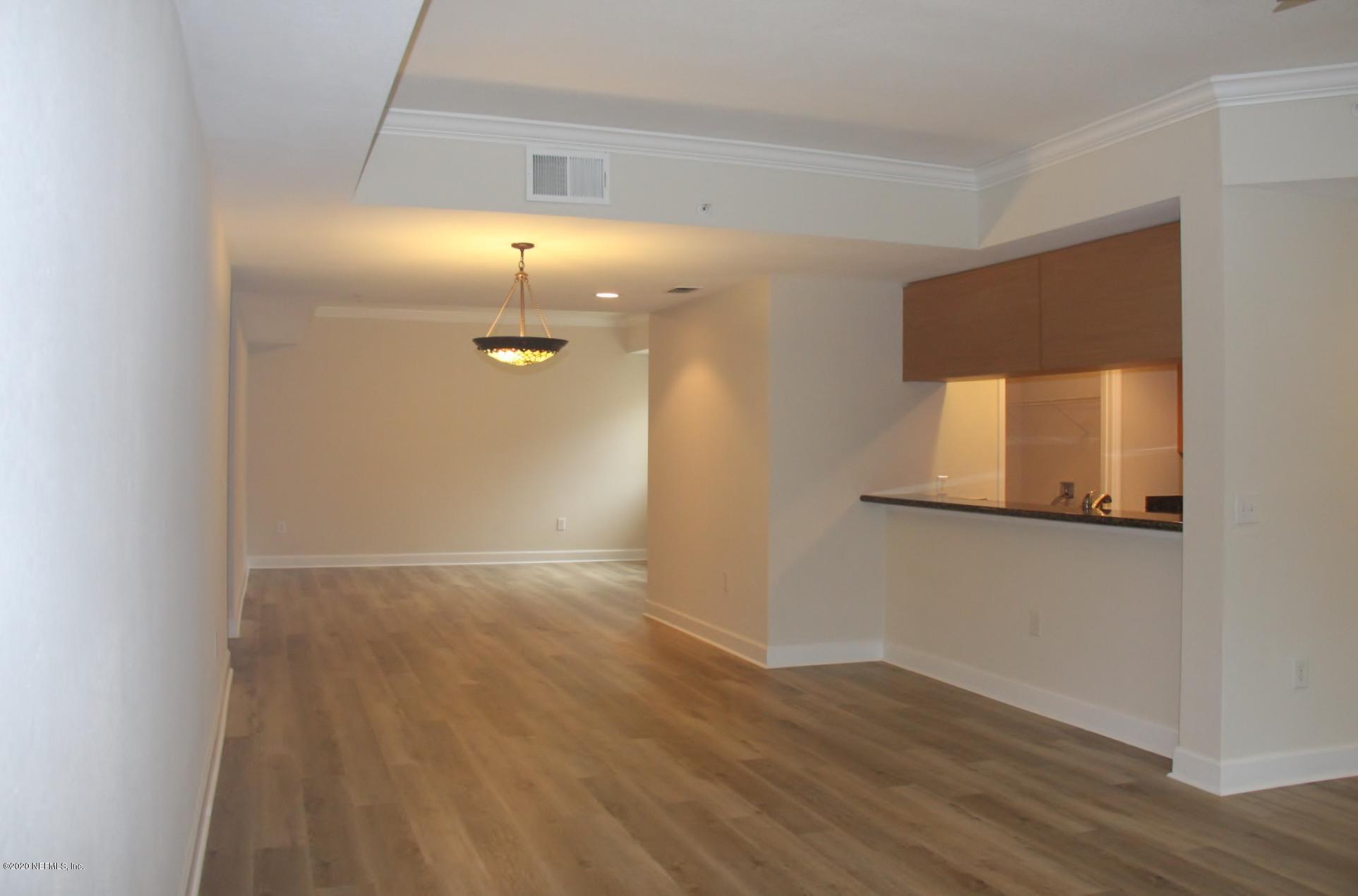 9745 Touchton Road, Unit 2401 Jacksonville, FL 32246 - Photo 8 of 50 a view of a hallway with wooden floor
