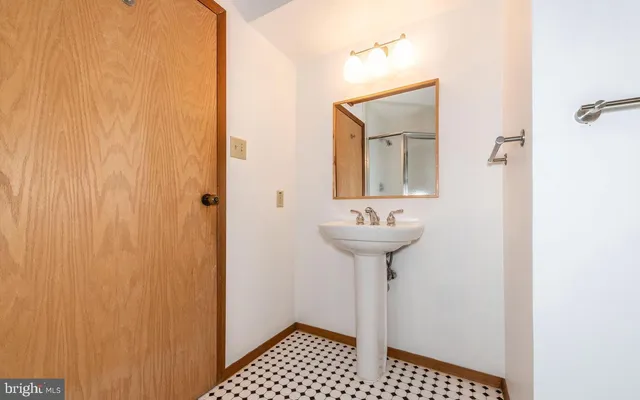 a bathroom with a sink toilet