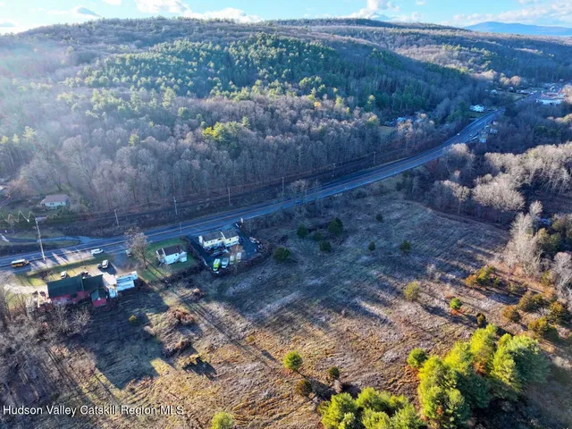 a view of a street with a yard