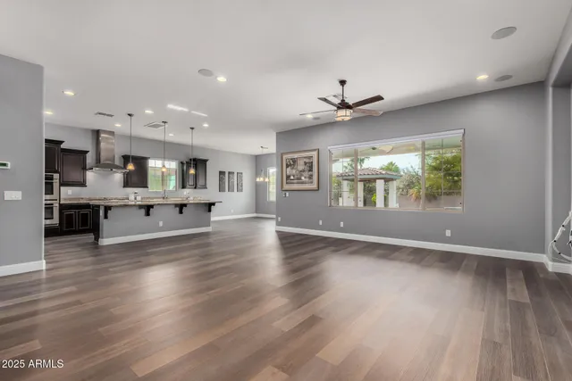 a view of a dining room with furniture and chandelier