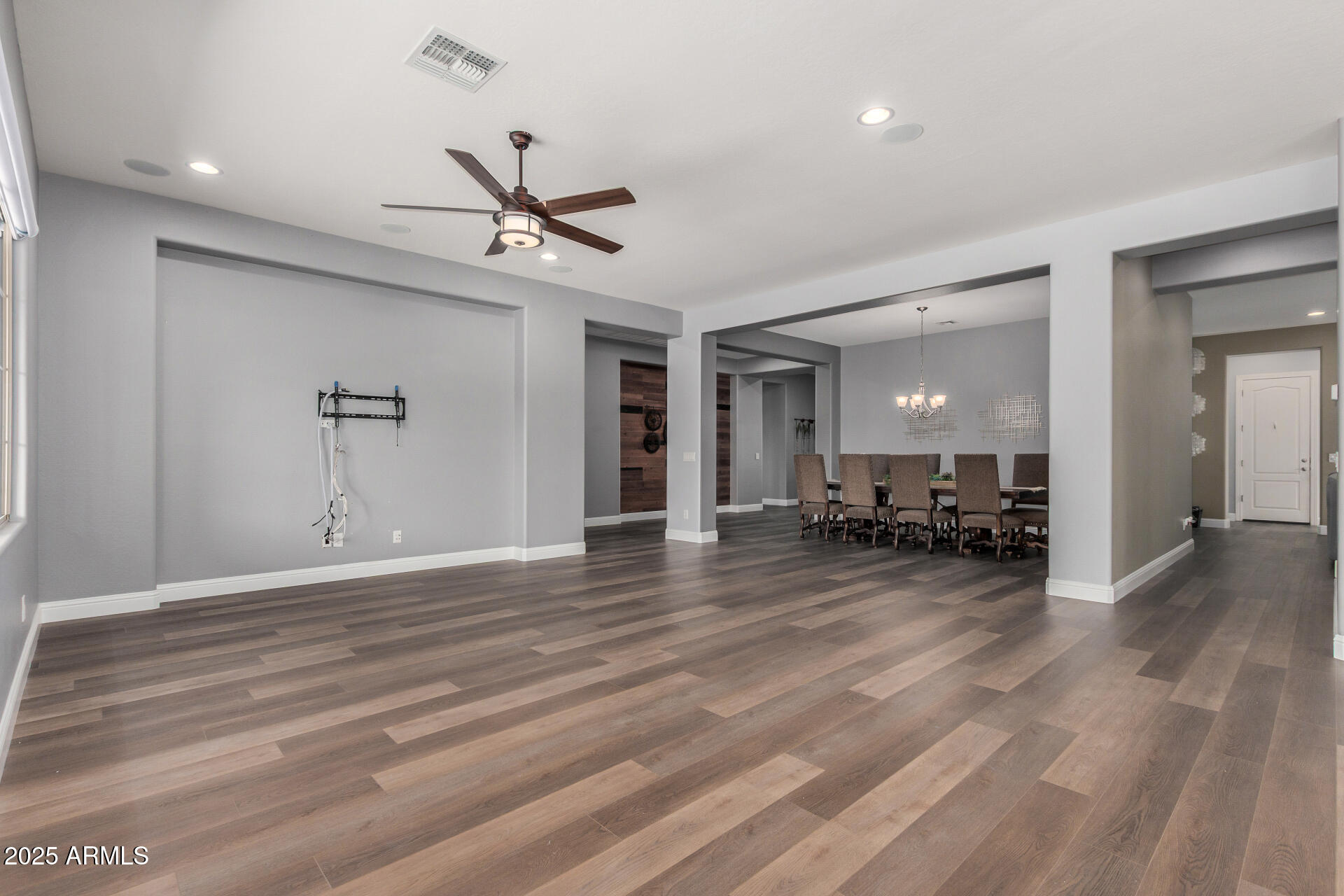 1672 South Sunset Drive Chandler, AZ 85286 - Photo 13 of 68 a view of a livingroom with a furniture hardwood floor and ceiling fan