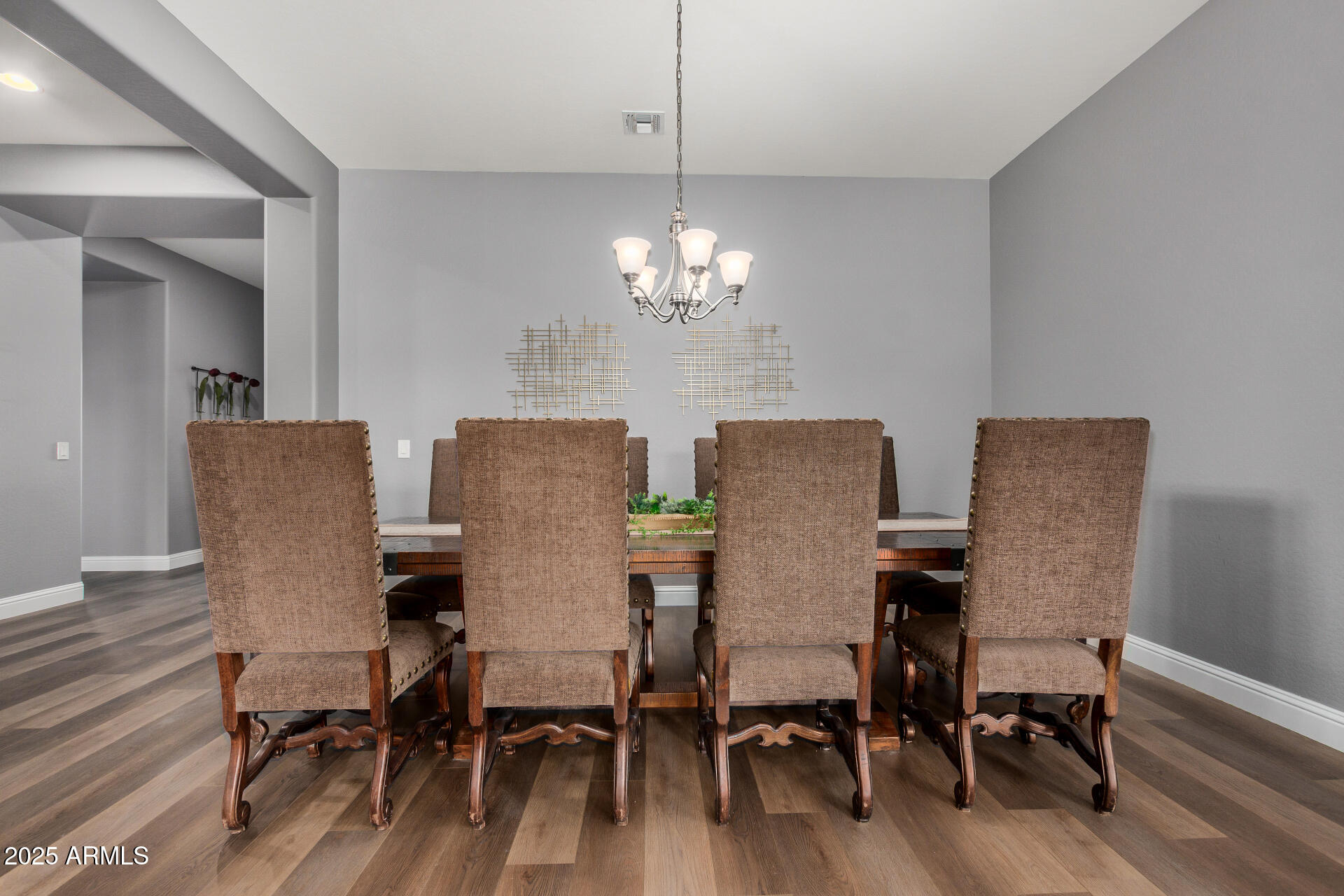 1672 South Sunset Drive Chandler, AZ 85286 - Photo 14 of 68 a view of a dining room with furniture and wooden floor