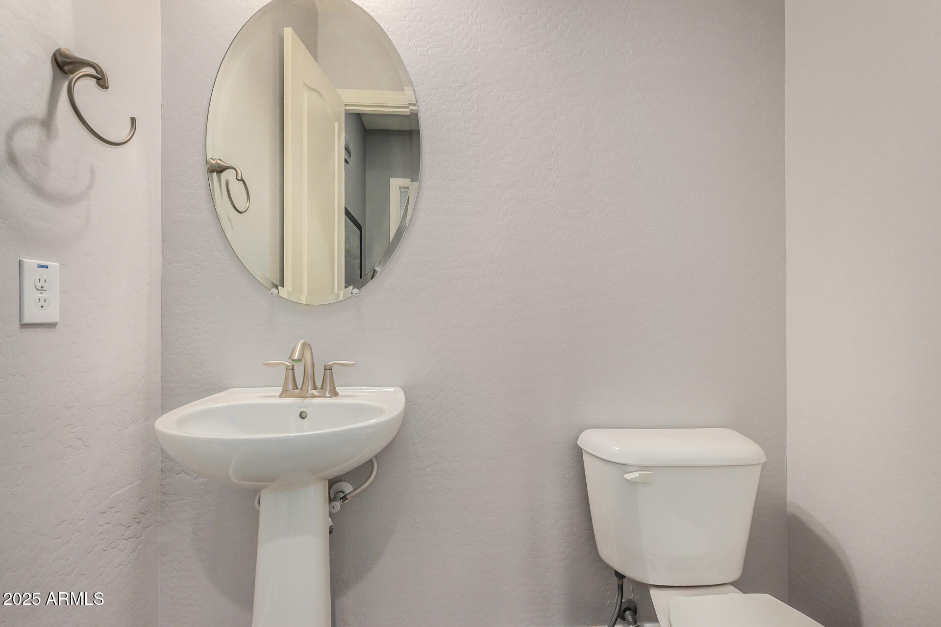 1672 South Sunset Drive Chandler, AZ 85286 - Photo 22 of 68 a bathroom with a toilet sink and mirror