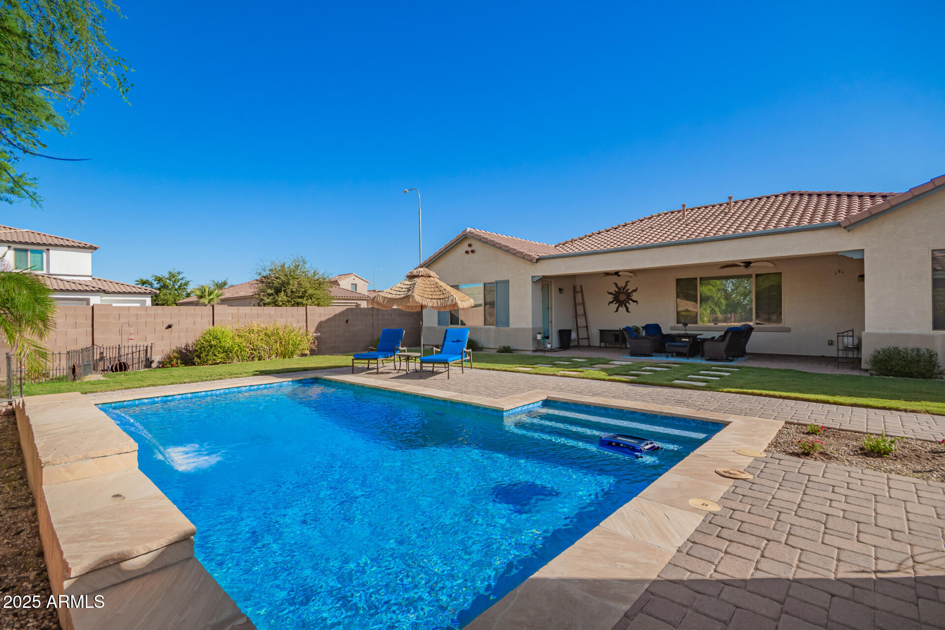 1672 South Sunset Drive Chandler, AZ 85286 - Photo 44 of 68 a view of swimming pool with lawn chairs and potted plants