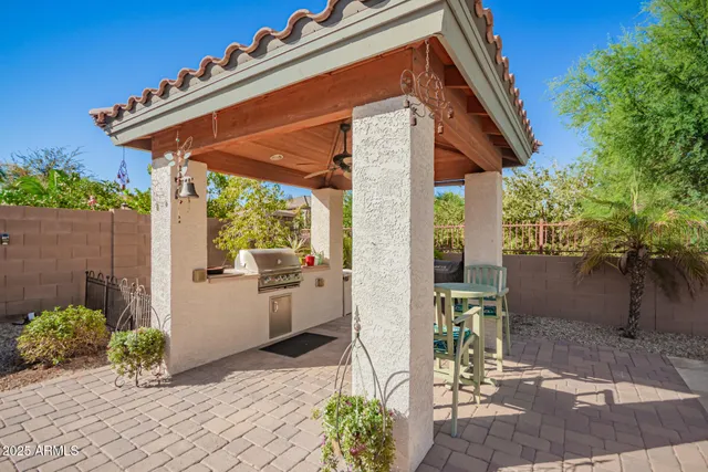 a view of an house with swimming pool patio and outdoor seating