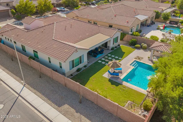 a living room with furniture and a ceiling fan