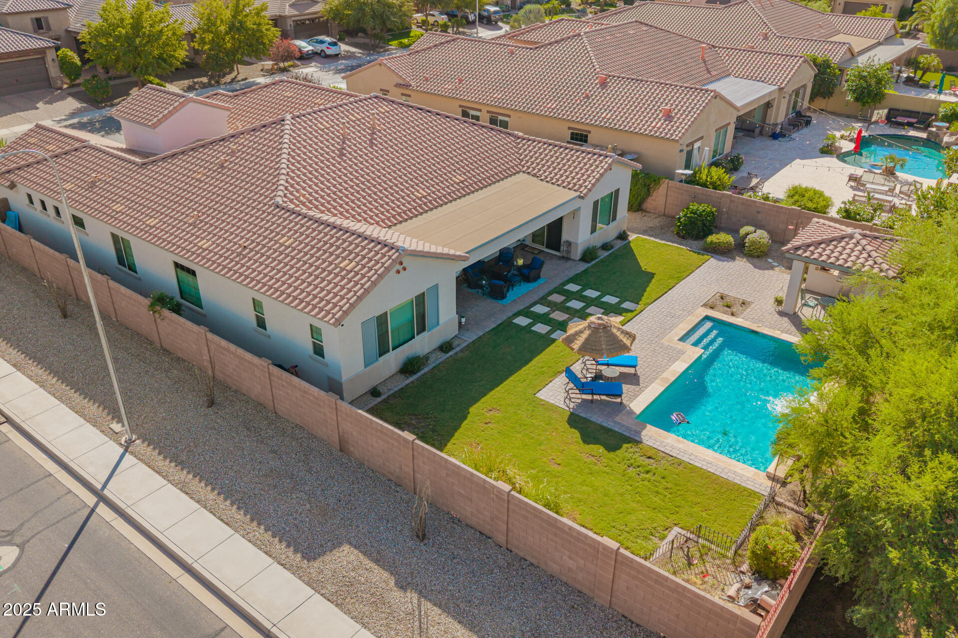 1672 South Sunset Drive Chandler, AZ 85286 - Photo 6 of 68 an aerial view of a house with a swimming pool