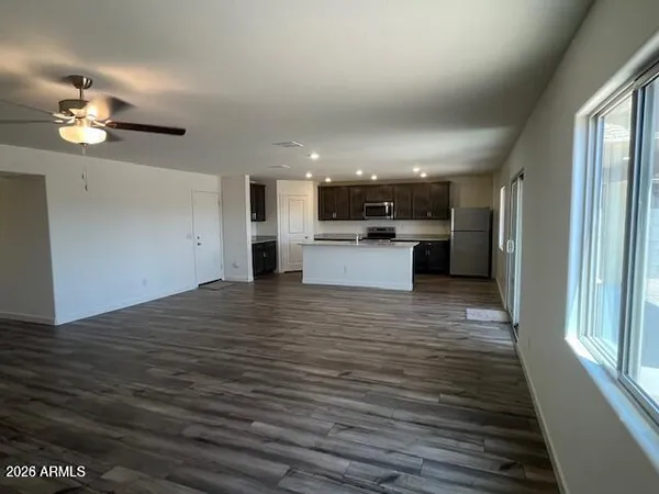 a view of a kitchen from the hallway