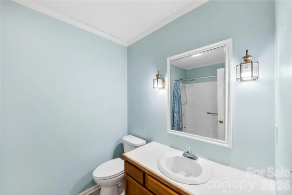 a bathroom with a sink toilet and vanity