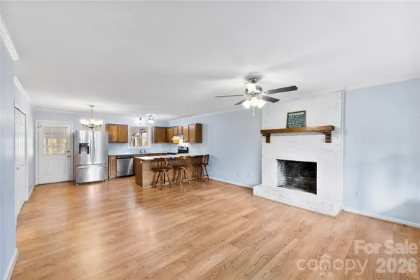 a view of kitchen with furniture and fireplace