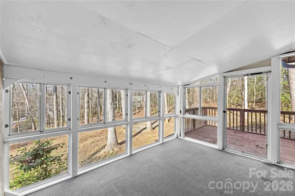 a view of an empty room with a balcony