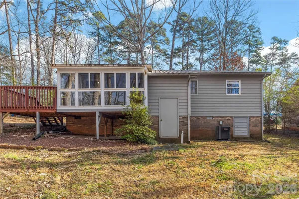 a view of a house with a yard and sitting area