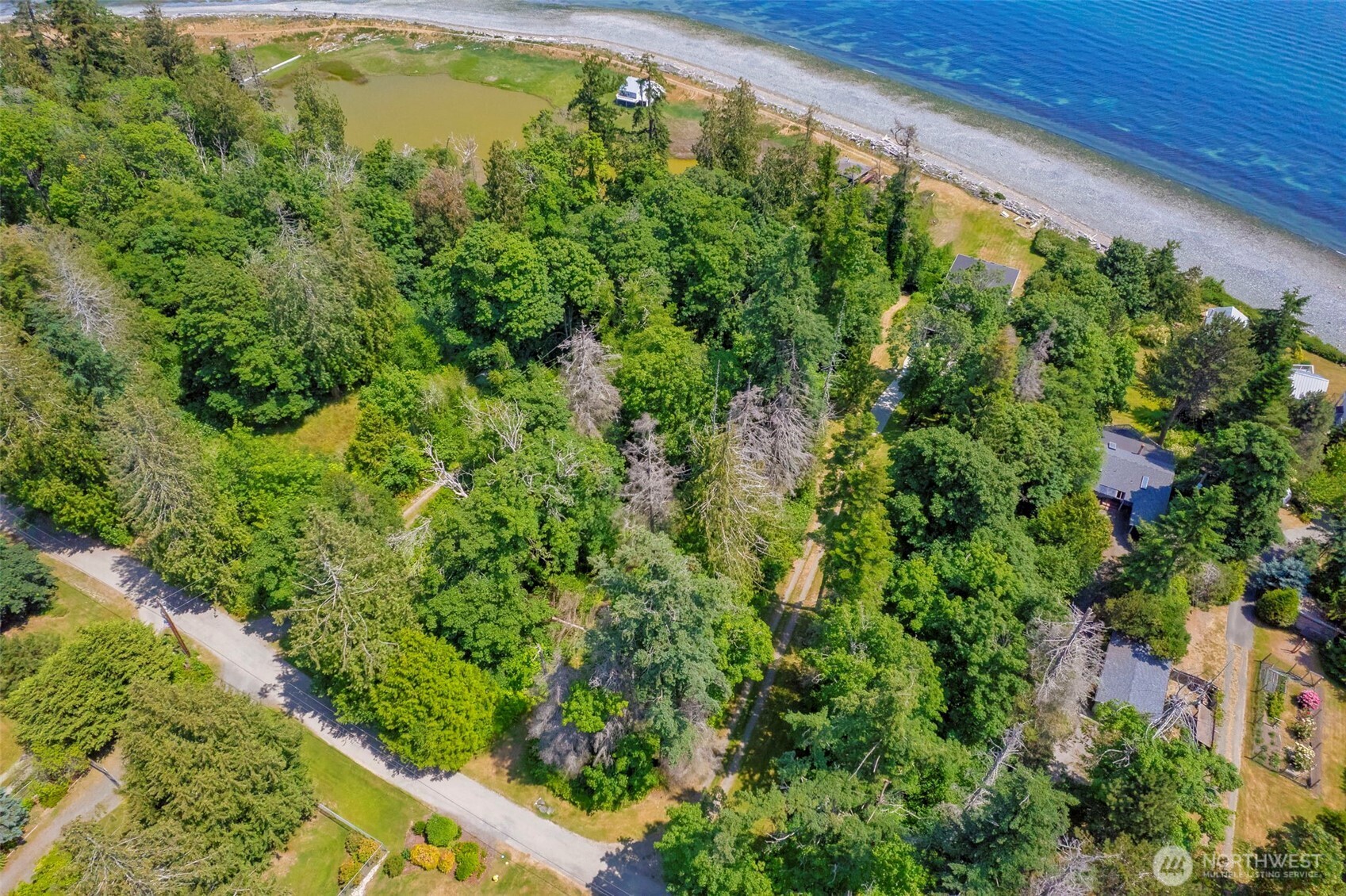 20818 President Point Road Northeast Kingston, WA 98346 - Photo 14 of 36 a view of a garden with a building