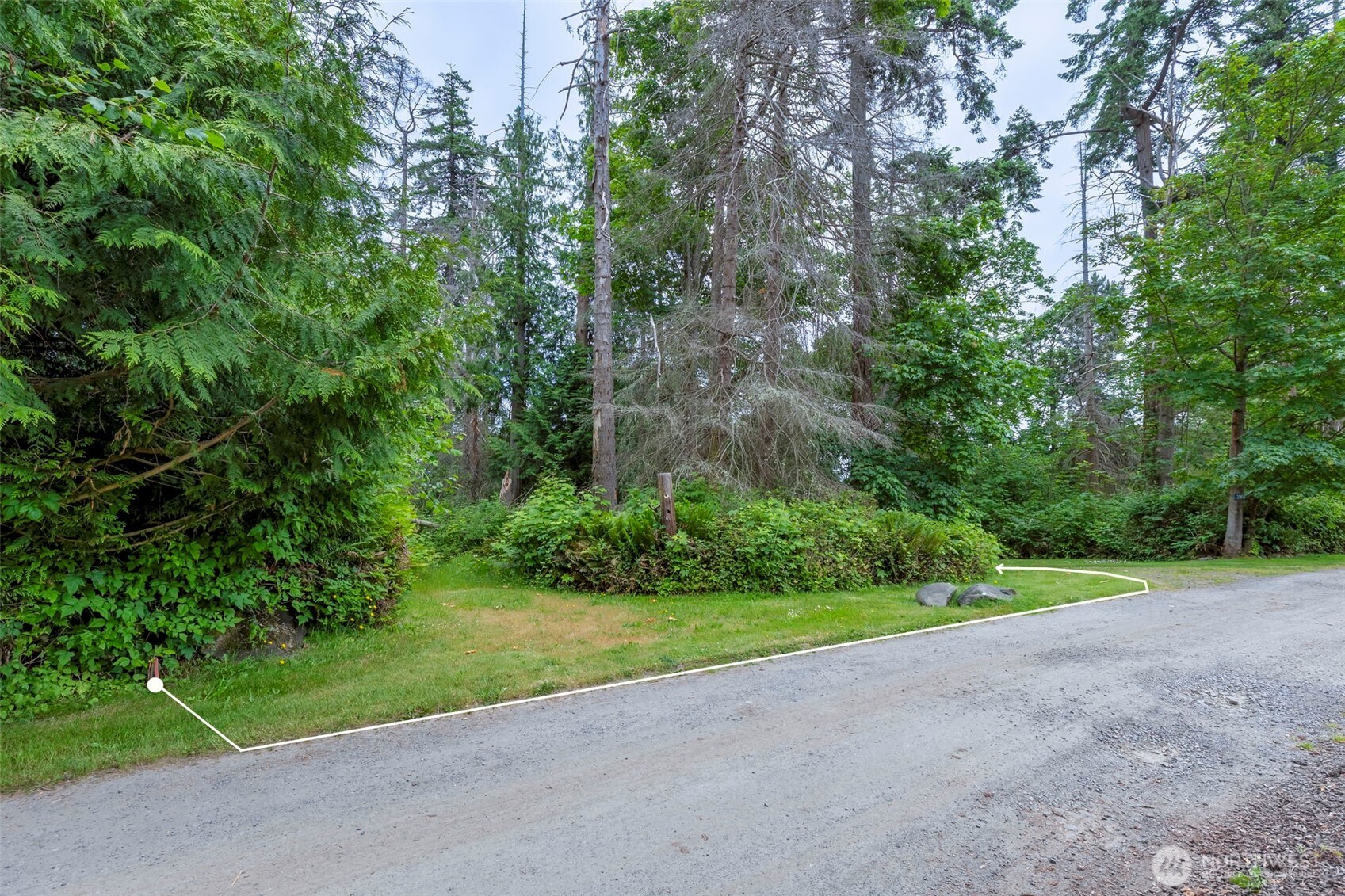 20818 President Point Road Northeast Kingston, WA 98346 - Photo 32 of 36 a view of a yard with a house