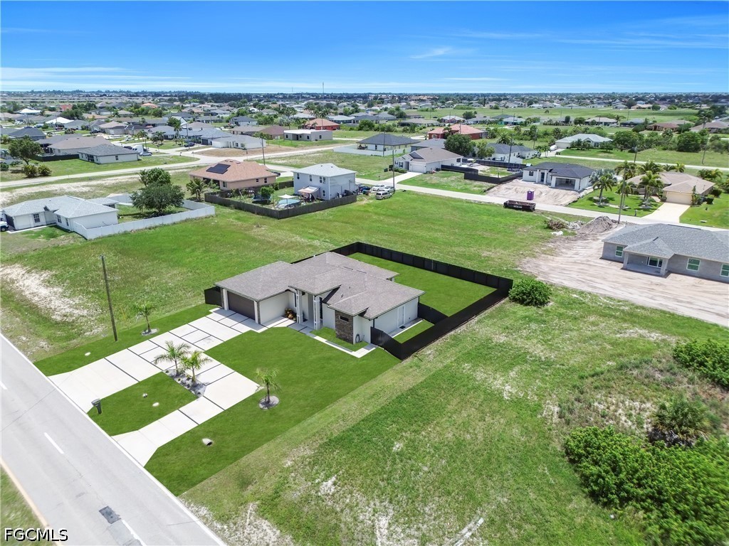 1128 Nelson Road North Cape Coral, FL 33993 - Photo 5 of 22 an aerial view of a house with outdoor space