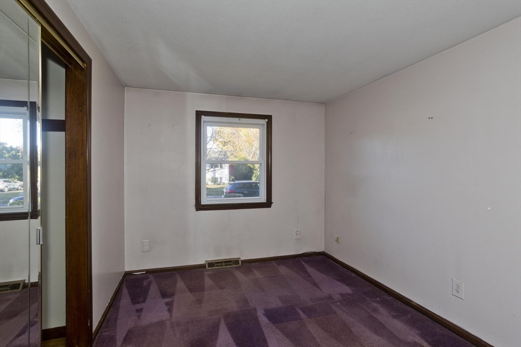 134 Mallard Circle Agawam, MA 01001 - Photo 18 of 36 an empty room with wooden floor and windows