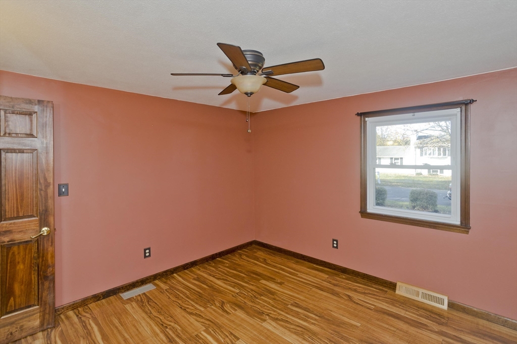 134 Mallard Circle Agawam, MA 01001 - Photo 22 of 36 a view of empty room with wooden floor and fan