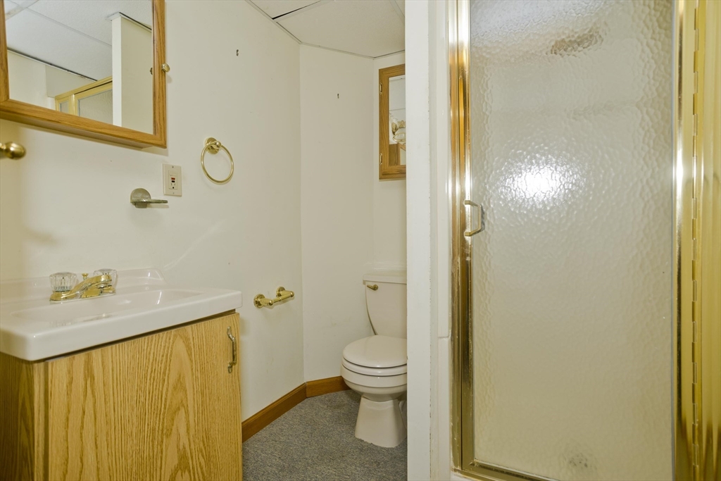 134 Mallard Circle Agawam, MA 01001 - Photo 32 of 36 a bathroom with a granite countertop sink and a mirror