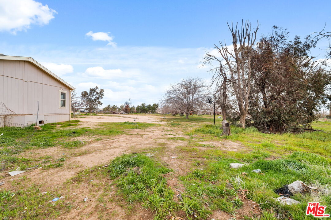 6425 Smoke Tree Road Phelan, CA 92371 - Photo 28 of 35 a view of yard with swimming pool and green space