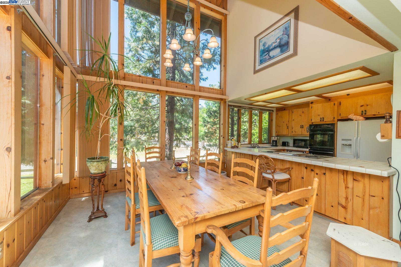 30 Dorleska Court Trinity Center, CA 96091 - Photo 12 of 50 a dining table with chairs and large windows