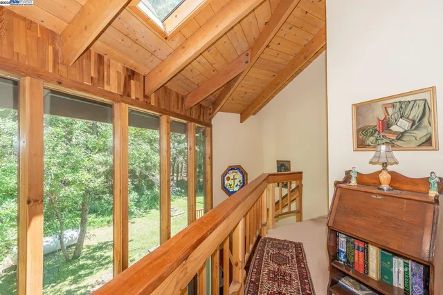 a bedroom with a large bed and a couch