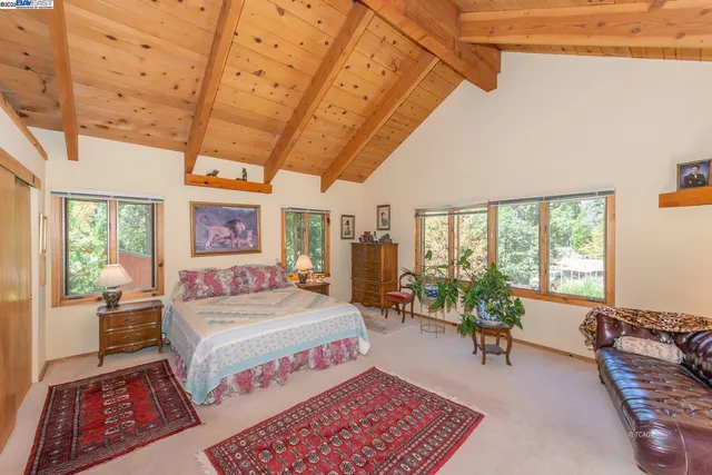 a bedroom with a bed and a table