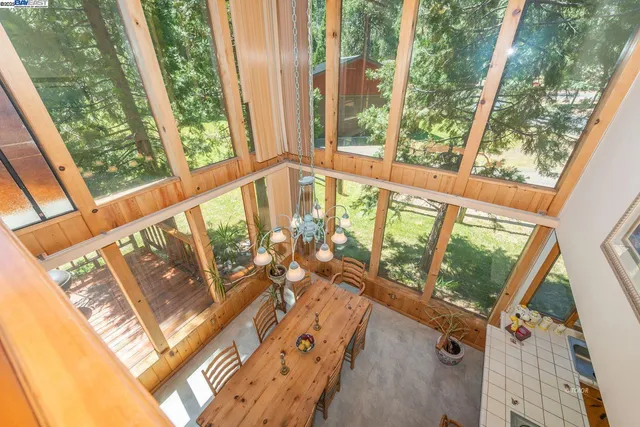 a view of a balcony with trees