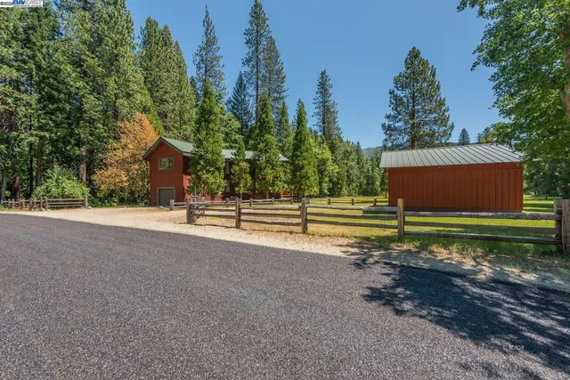 a backyard of a house with lots of green space