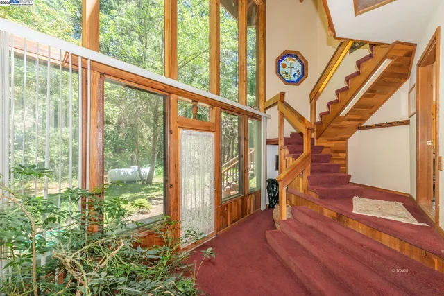 a view of entryway with a door and wooden floor