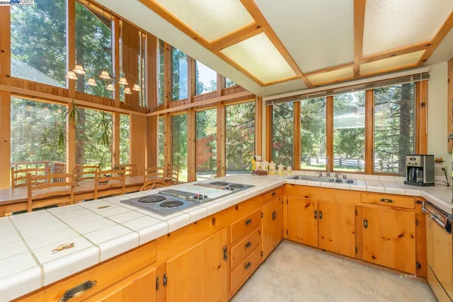 a large kitchen with a large window