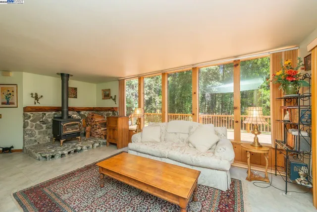 a living room with furniture city view and large windows