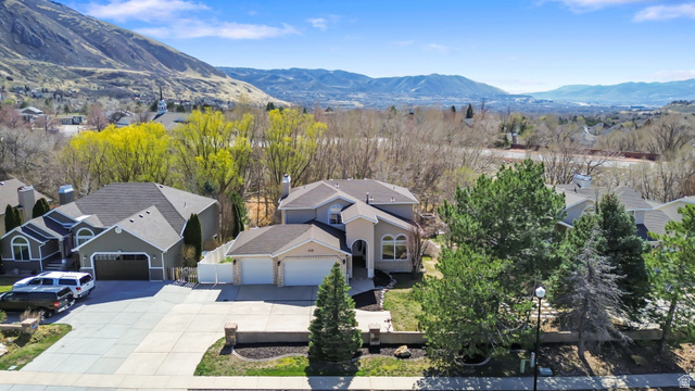 2122 Wasatch Boulevard Sandy, UT 84092 - Photo 1 of 1 Aerial perspective of suburban area featuring a mountainous background