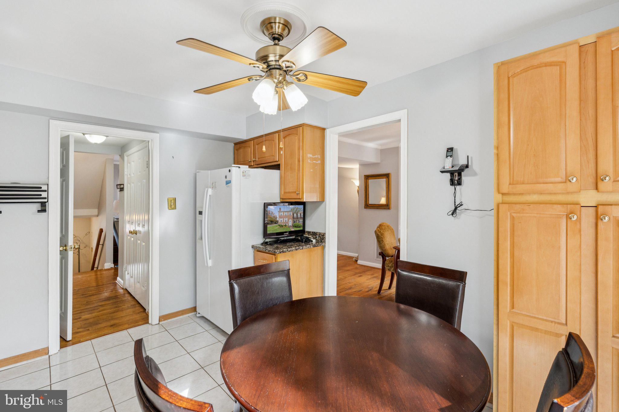 7029 Bradwood Court Springfield, VA 22151 - Photo 11 of 43 a living room with furniture and a chandelier