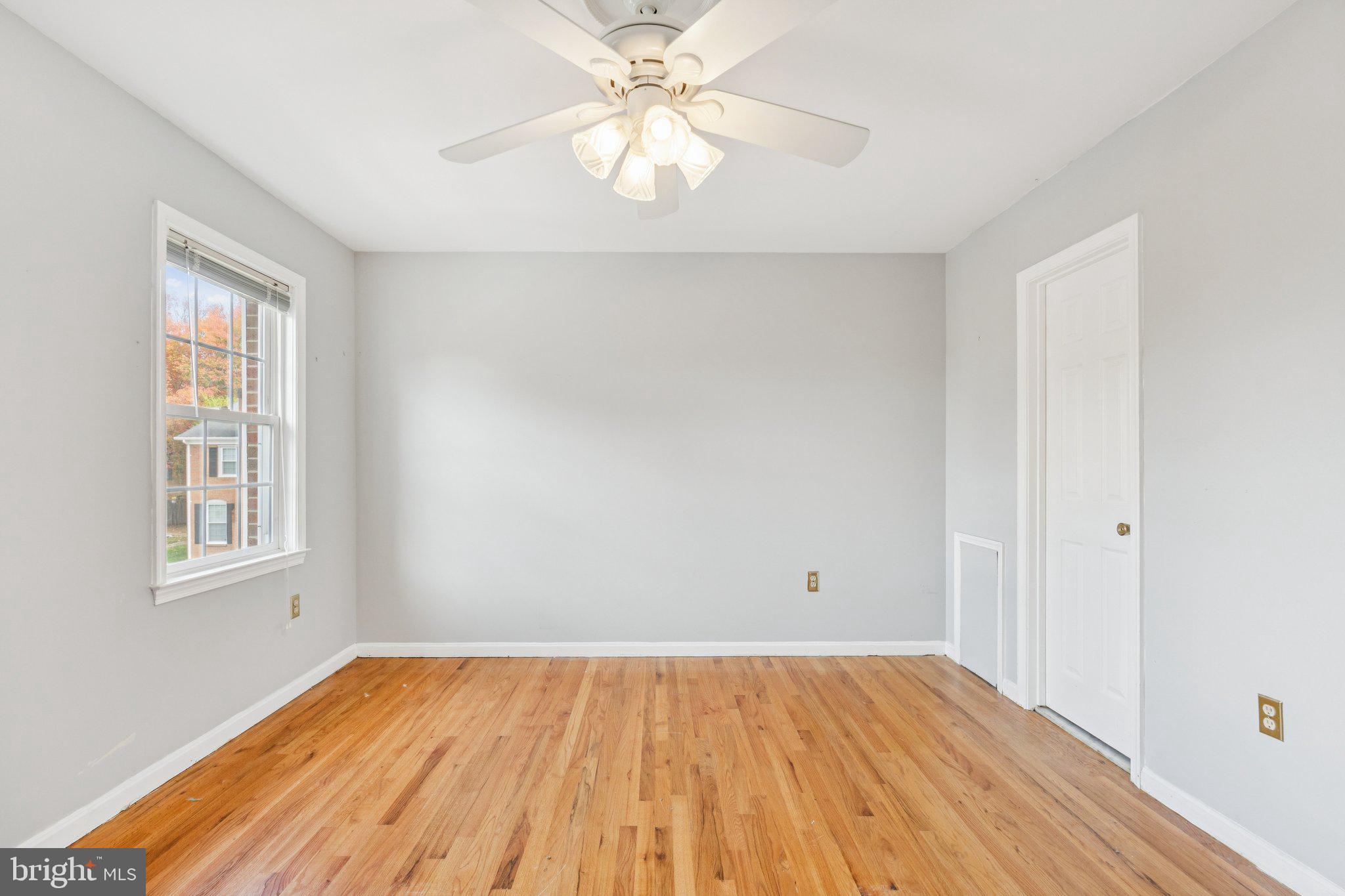 7029 Bradwood Court Springfield, VA 22151 - Photo 25 of 43 wooden floor in an empty room with a window