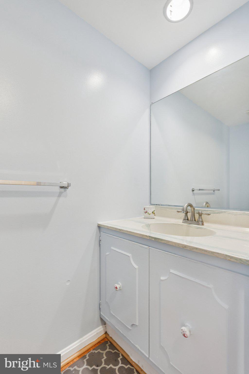 7029 Bradwood Court Springfield, VA 22151 - Photo 27 of 43 a bathroom with a sink and a mirror