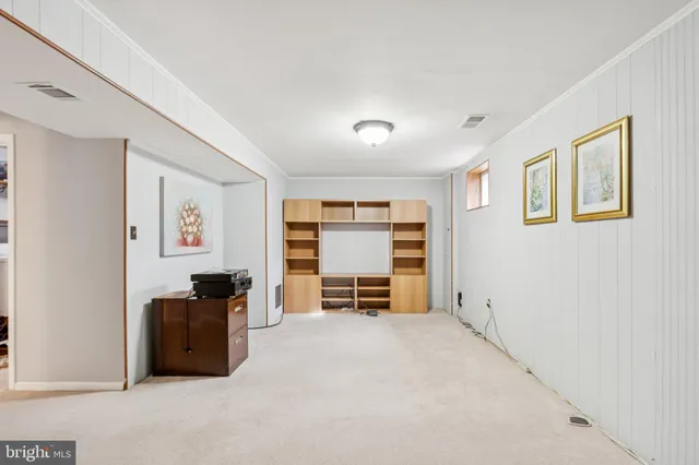 a view of workspace with furniture and windows