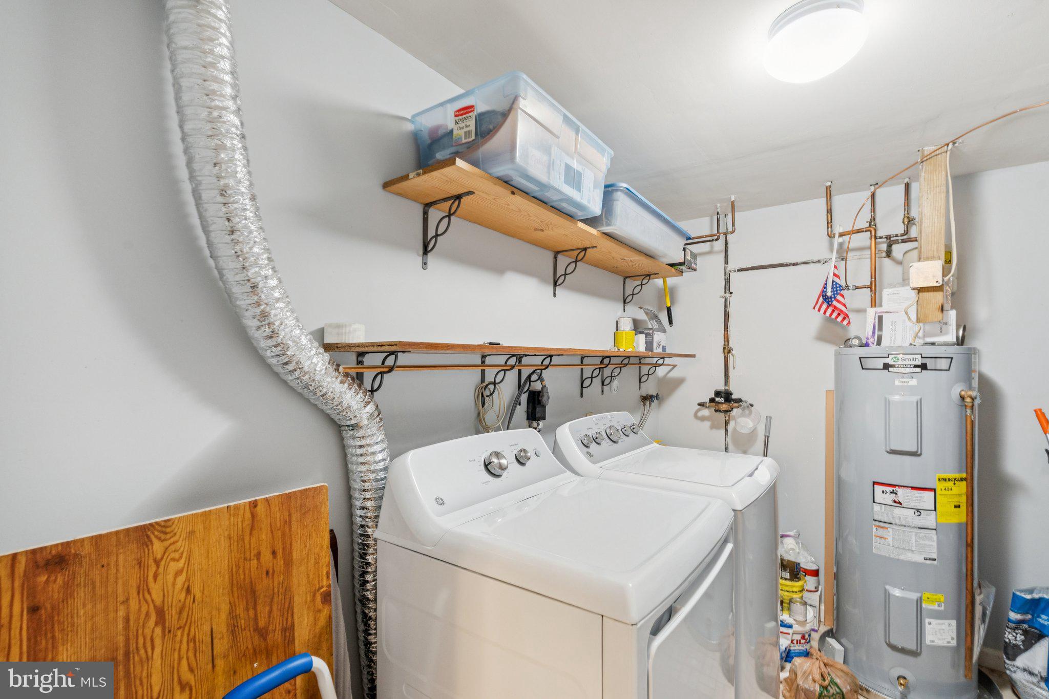 7029 Bradwood Court Springfield, VA 22151 - Photo 33 of 43 a utility room with dryer and washer
