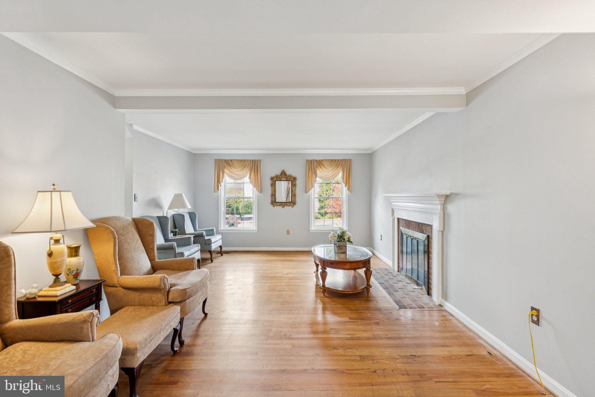 7029 Bradwood Court Springfield, VA 22151 - Photo 10 of 43 a living room with furniture and a wooden floor