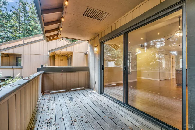 a view of a bathroom with a tub and windows
