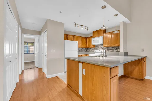 a bathroom with a sink a mirror and a shower