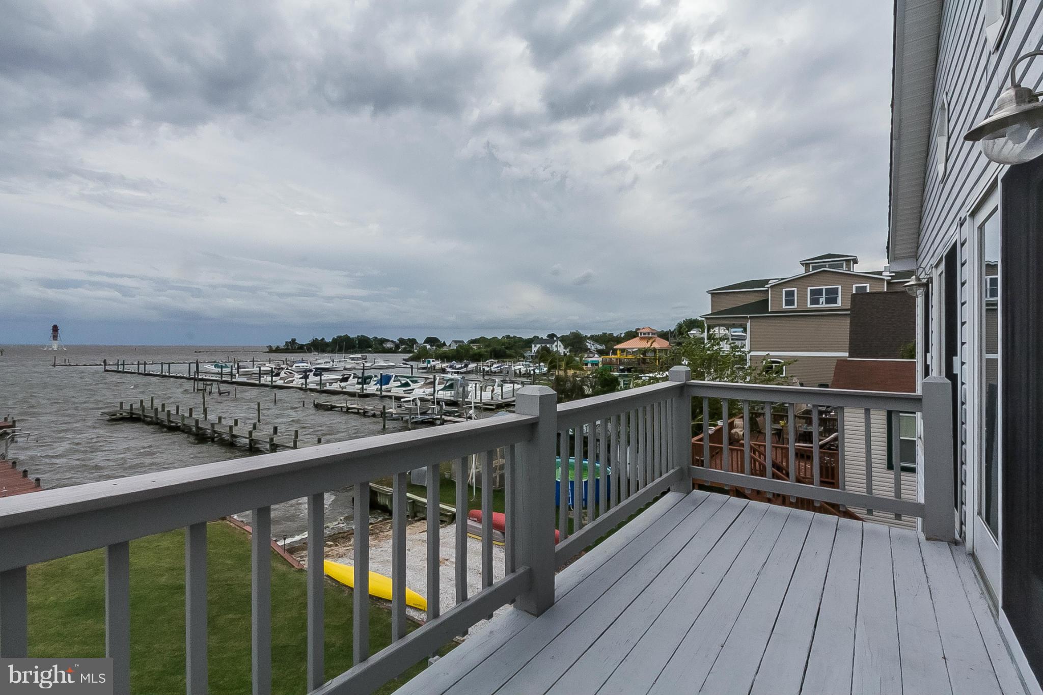 9103 Cuckold Point Road Baltimore, MD 21219 - Photo 18 of 28 a view of city from a balcony with wooden floor