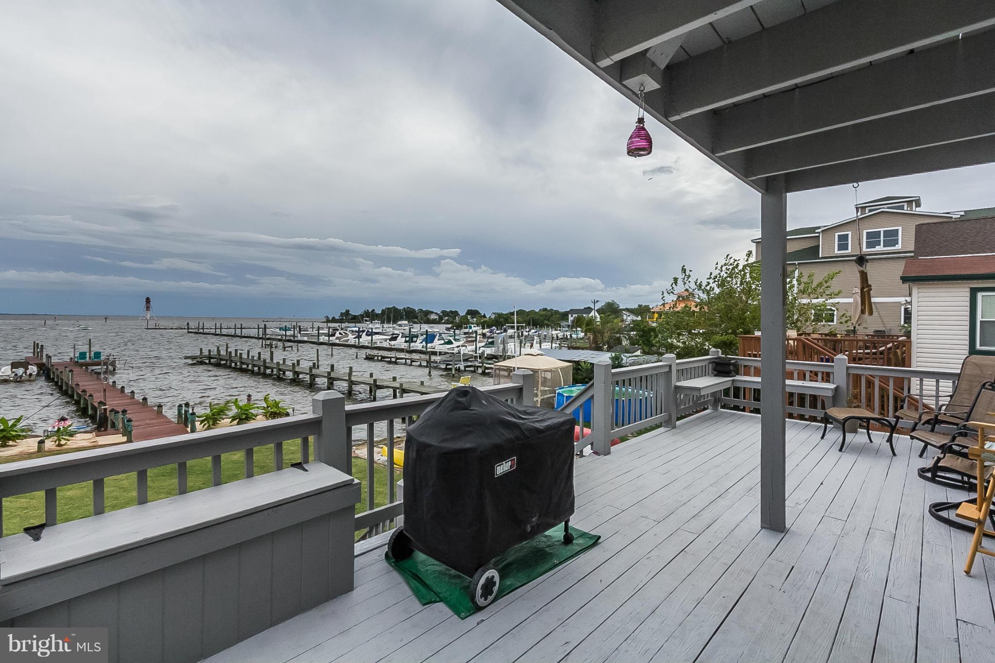 9103 Cuckold Point Road Baltimore, MD 21219 - Photo 24 of 28 a terrace with outdoor seating and city view