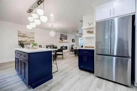 a kitchen with a stove and a microwave