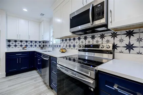 a view of a kitchen counter top and a table chair