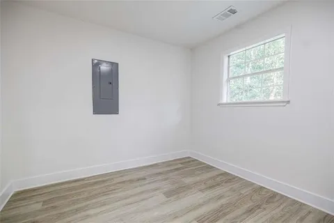 a bedroom with a bed and a view of walk in closet