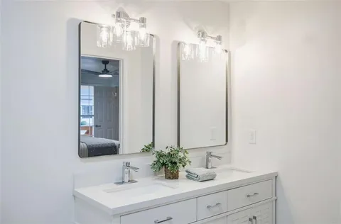 a bathroom with a shower and a sink