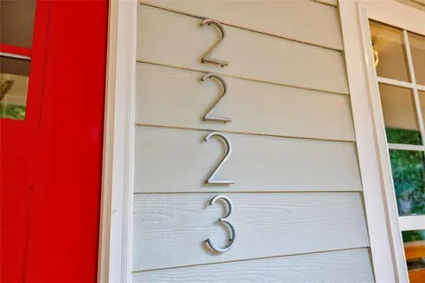 a view of balcony with wooden floor and fence