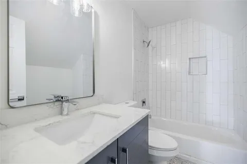 a balcony with wooden floor and yard